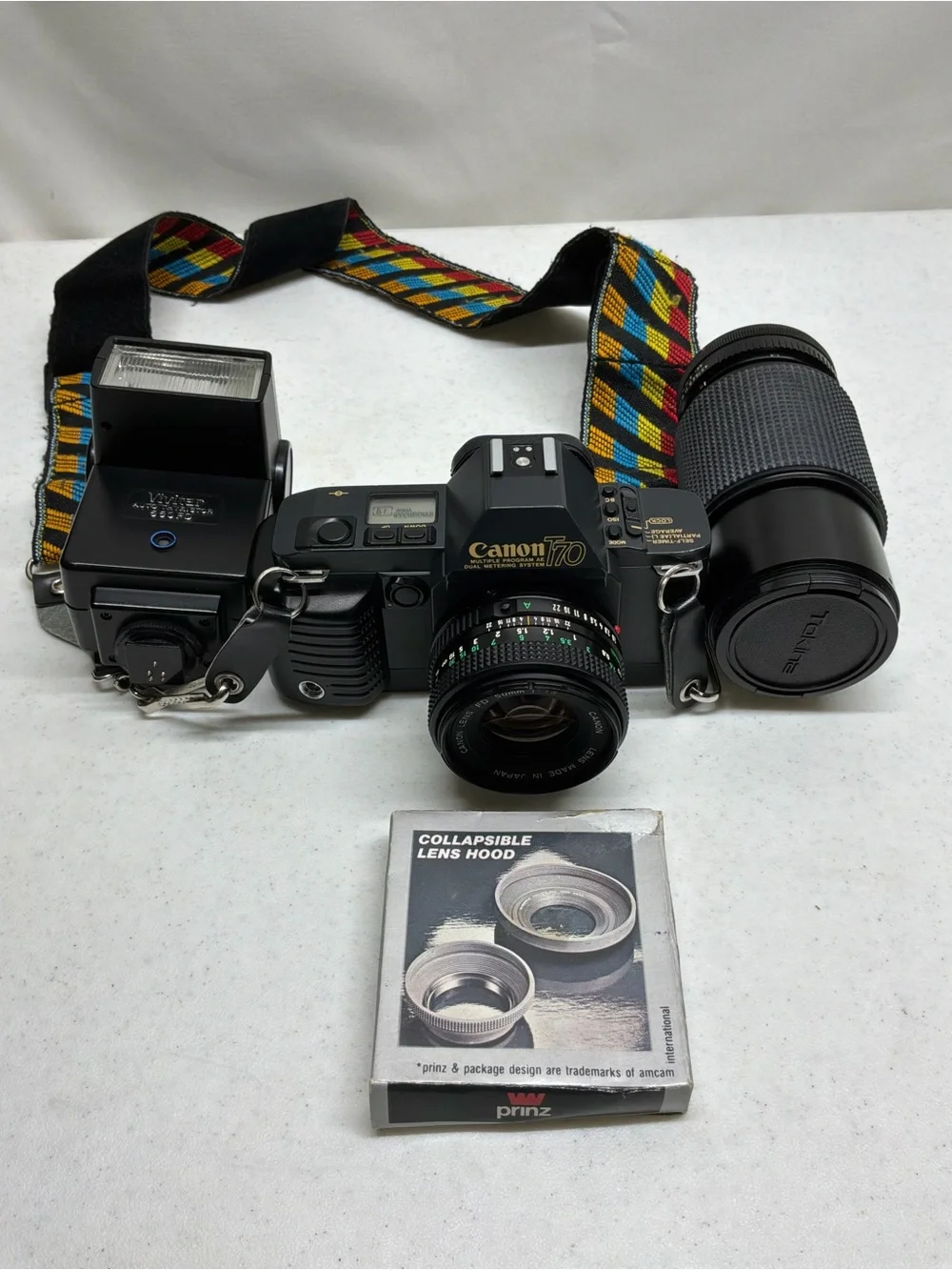 Canon T70 35mm SLR Camera with Black Telephoto Lens and Accessories
